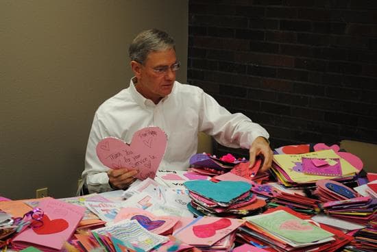 Rep. Blaine Luetkemeyer opening his early Valentine's Day cards from bank lobbyists. (Rep. Blaine Luetkemeyer)
